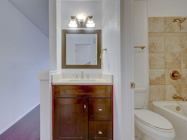 1710 Cinnamon Path, Austin, TX 78704 - full bath with vanity, toilet, wood finished floors, washtub / shower combination, and baseboards
