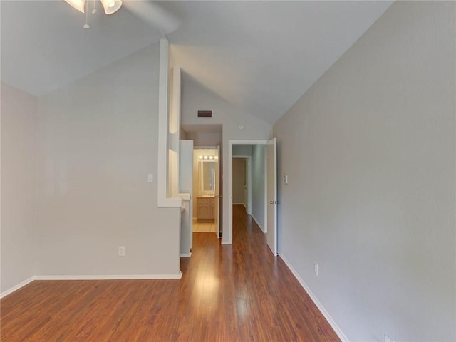 1710 Cinnamon Path, Austin, TX 78704 - empty room with wood finished floors, baseboards, a ceiling fan, and high vaulted ceiling