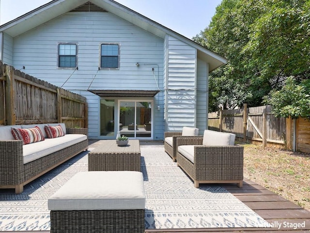 1710 Cinnamon Path, Austin, TX 78704 - rear view of house with an outdoor hangout area and a fenced backyard