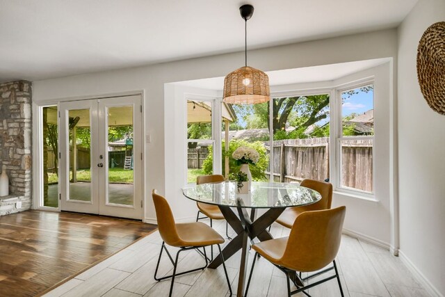 10300 Parkfield Dr, Austin, TX 78758 - dining area featuring french doors and light wood finished floors