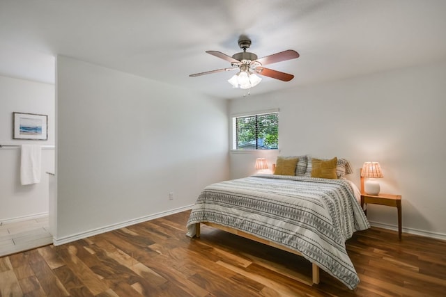 10300 Parkfield Dr, Austin, TX 78758 - bedroom featuring wood finished floors and a ceiling fan