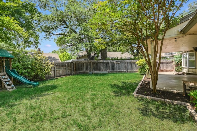 10300 Parkfield Dr, Austin, TX 78758 - fenced backyard with a playground and a patio