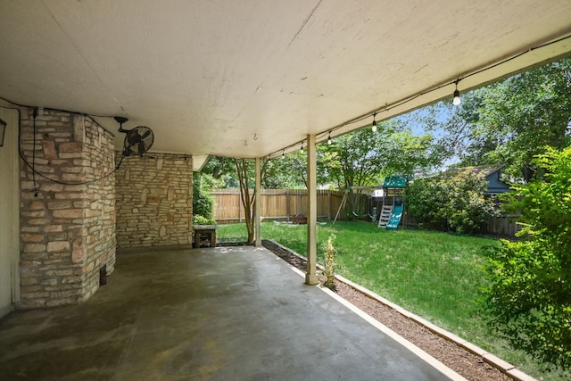 10300 Parkfield Dr, Austin, TX 78758 - fenced backyard with a playground and a patio