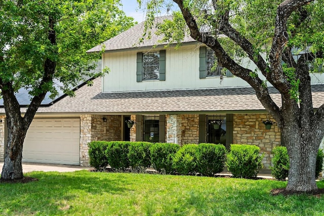 10300 Parkfield Dr, Austin, TX 78758 - view of front facade with stone siding, a shingled roof, a front yard, and covered porch