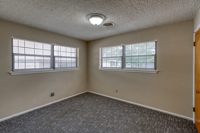 111 Dove Rd, Highland Haven, TX 78654 - carpeted spare room with baseboards and a textured ceiling