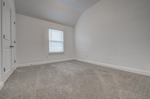 20908 Akbash Ln, Pflugerville, TX 78660 - carpeted spare room with vaulted ceiling and baseboards