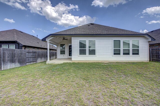 20908 Akbash Ln, Pflugerville, TX 78660 - rear view of house featuring ceiling fan, a fenced backyard, a patio area, and a shingled roof