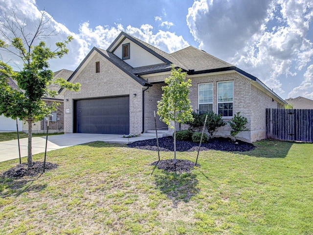 20908 Akbash Ln, Pflugerville, TX 78660 - french country style house with driveway, an attached garage, and brick siding