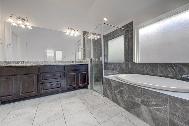 20908 Akbash Ln, Pflugerville, TX 78660 - full bath with a garden tub, double vanity, a stall shower, tile patterned floors, and a chandelier
