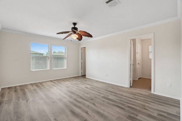 4608 Cleto St, Austin, TX 78725 - spare room featuring crown molding, a ceiling fan, wood finished floors, and baseboards