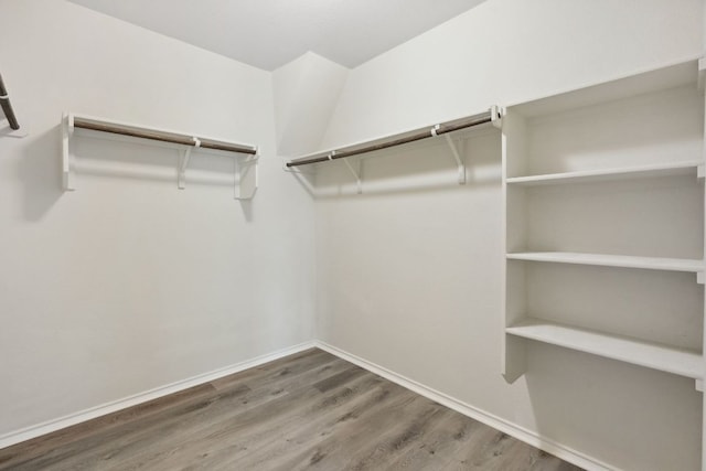 4608 Cleto St, Austin, TX 78725 - walk in closet featuring wood finished floors