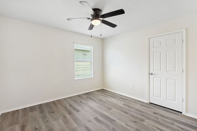 4608 Cleto St, Austin, TX 78725 - empty room featuring ceiling fan, wood finished floors, and baseboards