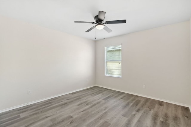 4608 Cleto St, Austin, TX 78725 - spare room featuring wood finished floors, baseboards, and ceiling fan