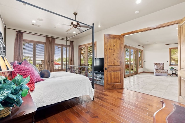 507 Sandy Mountain Dr, Sunrise Beach, TX 78643 - bedroom featuring wood finished floors, access to outside, recessed lighting, french doors, and a ceiling fan
