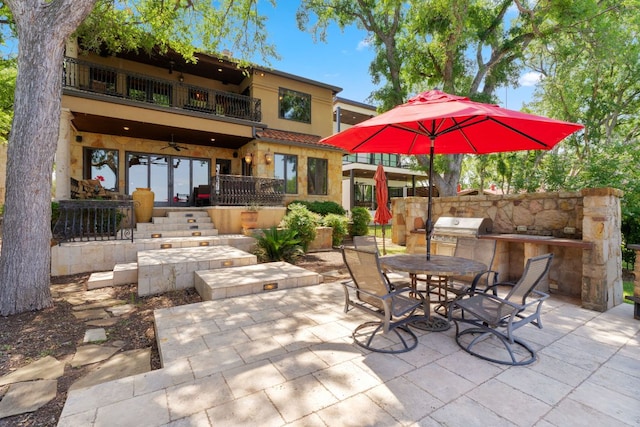 507 Sandy Mountain Dr, Sunrise Beach, TX 78643 - view of patio / terrace featuring a balcony, outdoor dining area, and ceiling fan