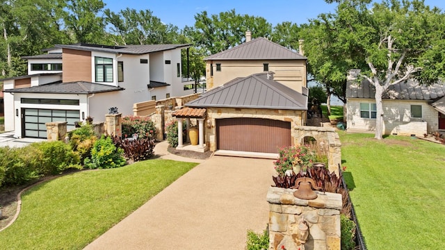507 Sandy Mountain Dr, Sunrise Beach, TX 78643 - view of front of house with stone siding, a front lawn, a standing seam roof, and driveway