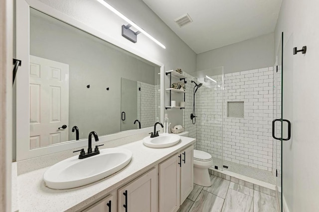 2407 Powderham Ln S, Cedar Park, TX 78613 - full bathroom with a stall shower, double vanity, and toilet