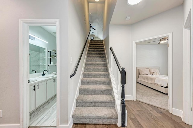 2407 Powderham Ln S, Cedar Park, TX 78613 - staircase featuring wood finished floors and baseboards