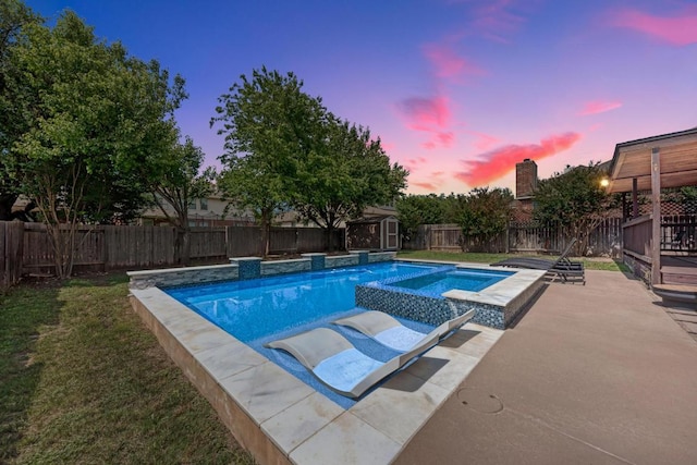 2407 Powderham Ln S, Cedar Park, TX 78613 - pool at dusk with an in-ground hot tub