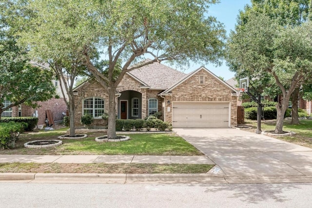 2407 Powderham Ln S, Cedar Park, TX 78613 - view of front facade featuring an attached garage, brick siding, driveway, a front yard, and a shingled roof