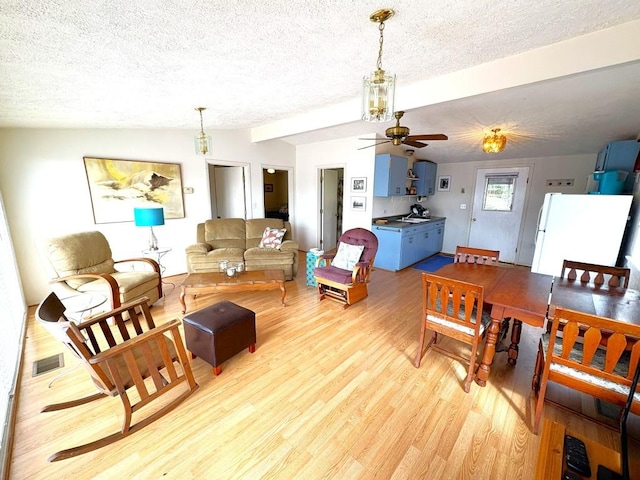 315 Skyline Dr, Sunrise Beach, TX 78643 - living area with a textured ceiling, light wood-style floors, a ceiling fan, and lofted ceiling