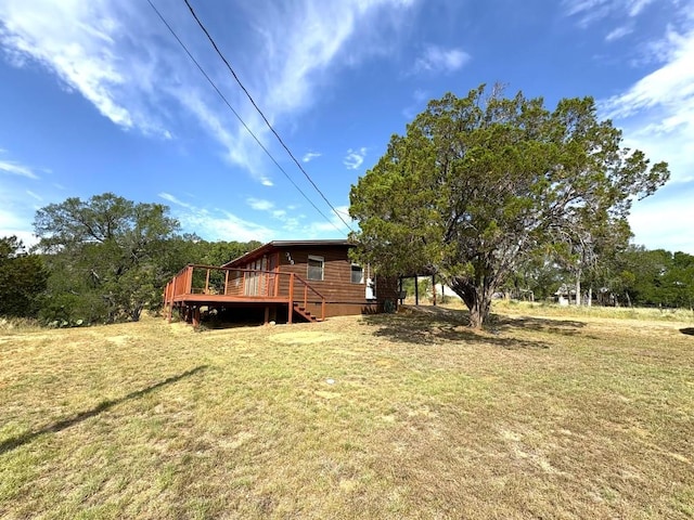 315 Skyline Dr, Sunrise Beach, TX 78643 - view of grassy yard with a deck and stairs