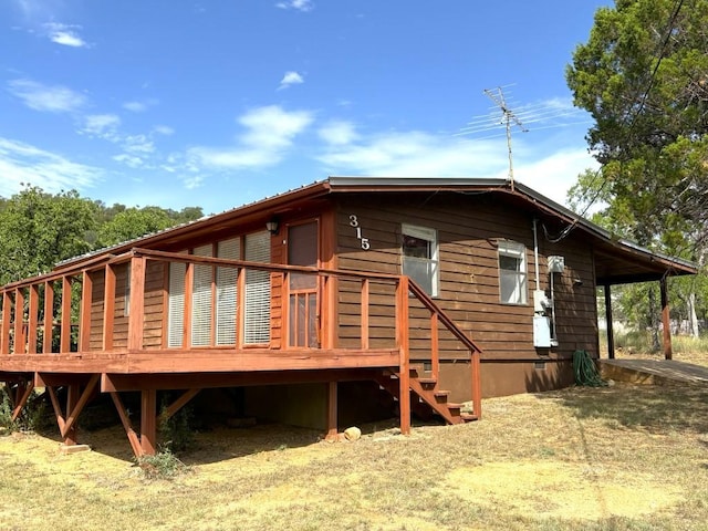 315 Skyline Dr, Sunrise Beach, TX 78643 - rear view of property with a deck