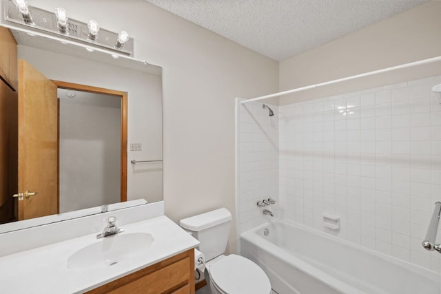 2309 Westoak Dr, Austin, TX 78704 - full bathroom featuring toilet, vanity, shower / bathtub combination, and a textured ceiling