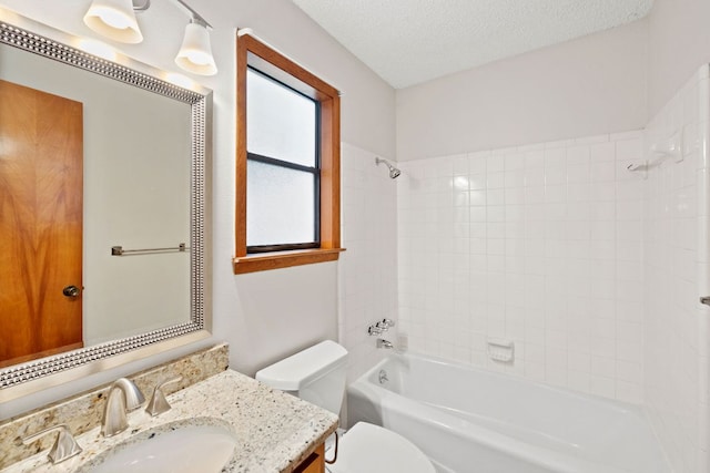 2309 Westoak Dr, Austin, TX 78704 - bathroom with toilet, vanity, bathing tub / shower combination, and a textured ceiling