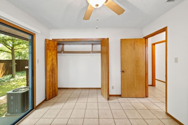 2309 Westoak Dr, Austin, TX 78704 - unfurnished bedroom with a textured ceiling, a closet, ceiling fan, and baseboards