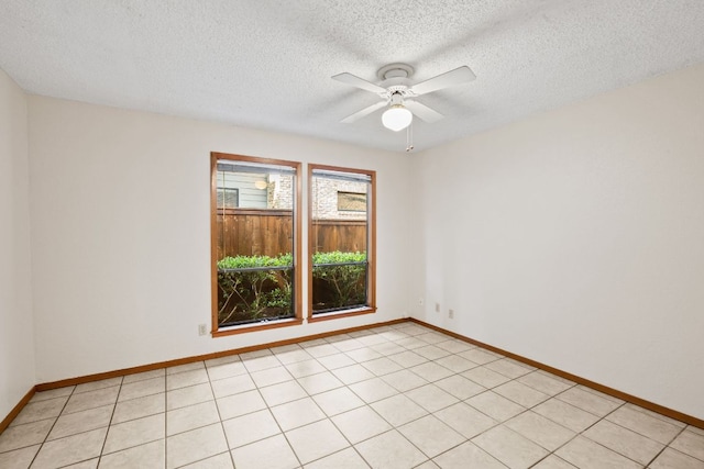 2309 Westoak Dr, Austin, TX 78704 - spare room with a textured ceiling, a ceiling fan, and baseboards