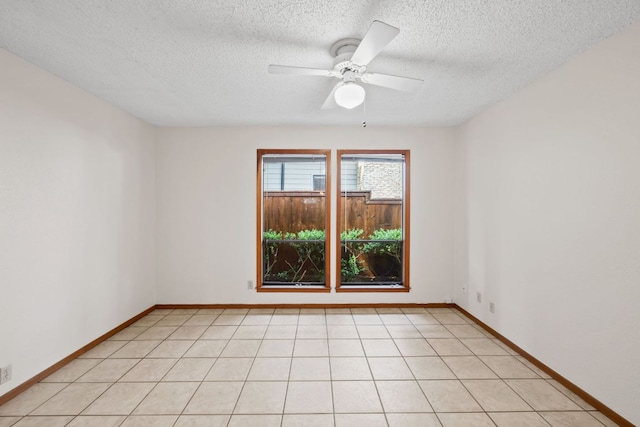 2309 Westoak Dr, Austin, TX 78704 - empty room with a textured ceiling, ceiling fan, and baseboards