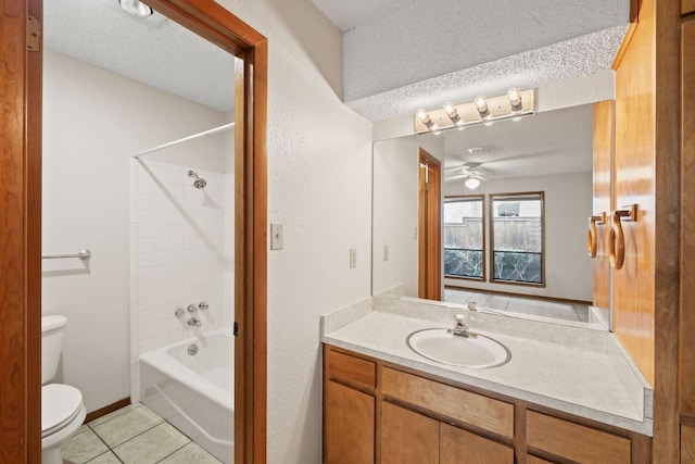 2309 Westoak Dr, Austin, TX 78704 - full bath with toilet, tile patterned floors, ceiling fan, vanity, and a textured ceiling