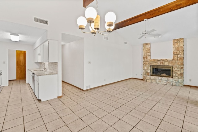 2309 Westoak Dr, Austin, TX 78704 - kitchen featuring a sink, white cabinets, light tile patterned flooring, a ceiling fan, and tasteful backsplash