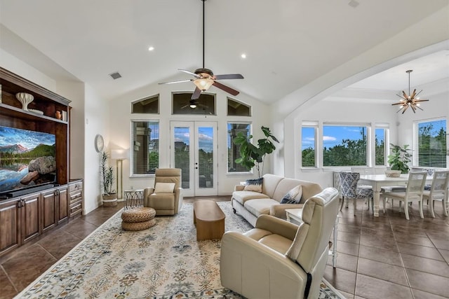 9501 Derecho Bnd, Austin, TX 78737 - living area featuring dark tile patterned flooring, a chandelier, ceiling fan, a high ceiling, and arched walkways