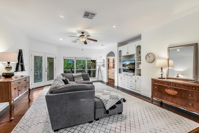 9501 Derecho Bnd, Austin, TX 78737 - living room featuring dark wood-style flooring, ceiling fan, recessed lighting, arched walkways, and french doors