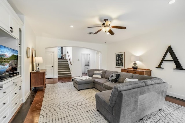 9501 Derecho Bnd, Austin, TX 78737 - living room featuring arched walkways, ceiling fan, stairs, baseboards, and recessed lighting