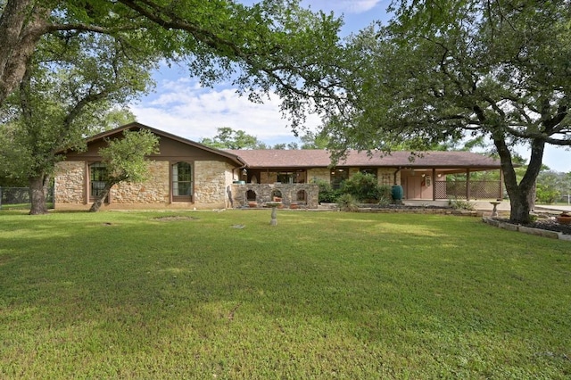 300 W Sequoia Spur, Georgetown, TX 78628 - back of house with a lawn and stone siding