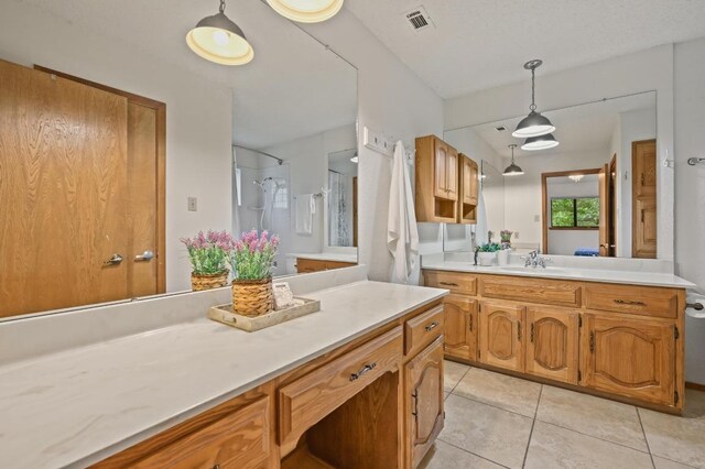 300 W Sequoia Spur, Georgetown, TX 78628 - full bath with vanity, tile patterned floors, and a shower