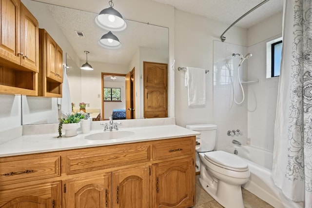 300 W Sequoia Spur, Georgetown, TX 78628 - bathroom with vanity, shower / bath combination with curtain, toilet, healthy amount of natural light, and a textured ceiling