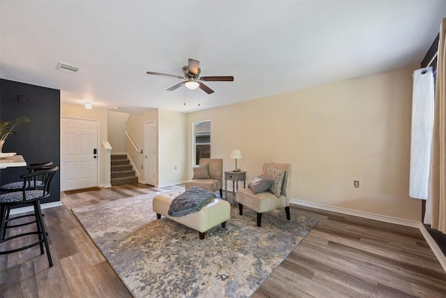 11607 Robert Wooding Dr, Austin, TX 78748 - sitting room with stairway, wood finished floors, a ceiling fan, and baseboards