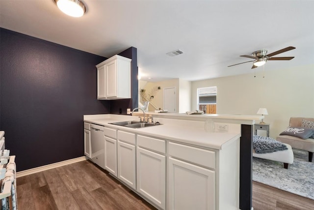 11607 Robert Wooding Dr, Austin, TX 78748 - kitchen with a sink, a peninsula, open floor plan, dishwasher, and dark wood finished floors