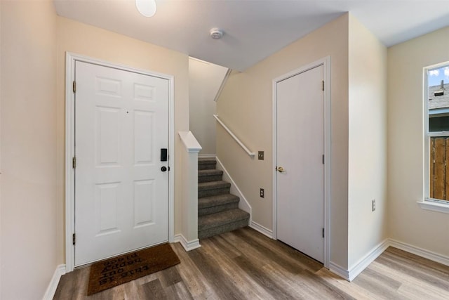 11607 Robert Wooding Dr, Austin, TX 78748 - foyer featuring wood finished floors, stairs, and baseboards