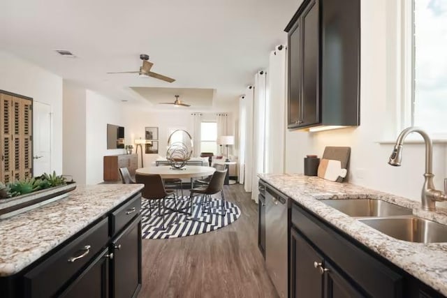 814 Cherrystone Loop, Buda, TX 78610 - kitchen featuring a sink, dishwasher, open floor plan, wood finished floors, and ceiling fan