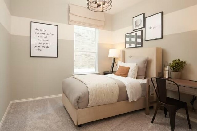814 Cherrystone Loop, Buda, TX 78610 - bedroom featuring a chandelier, carpet flooring, and baseboards