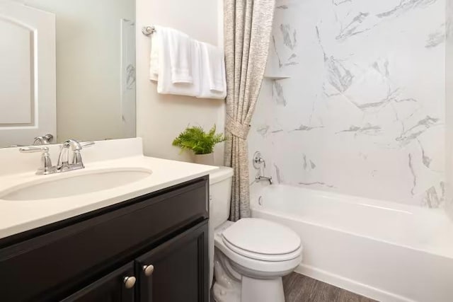 814 Cherrystone Loop, Buda, TX 78610 - full bath with shower / bath combo with shower curtain, vanity, toilet, and wood finished floors