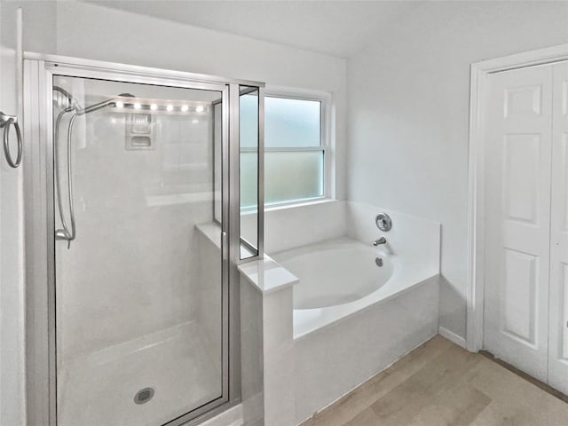 126 Waterlily Way, Hutto, TX 78634 - full bathroom featuring a garden tub and a stall shower