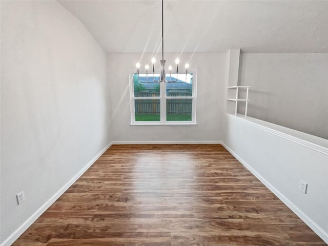 126 Waterlily Way, Hutto, TX 78634 - unfurnished dining area featuring a chandelier, wood finished floors, and lofted ceiling