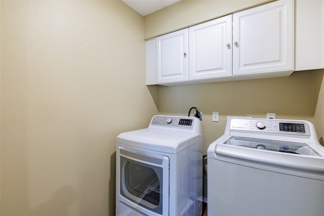 1301 Chardonnay Xing, Leander, TX 78641 - laundry room featuring cabinet space and separate washer and dryer