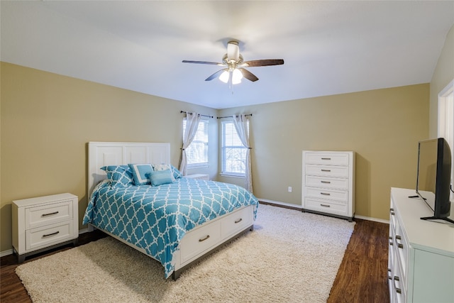 1301 Chardonnay Xing, Leander, TX 78641 - bedroom with dark wood-style flooring, baseboards, and a ceiling fan